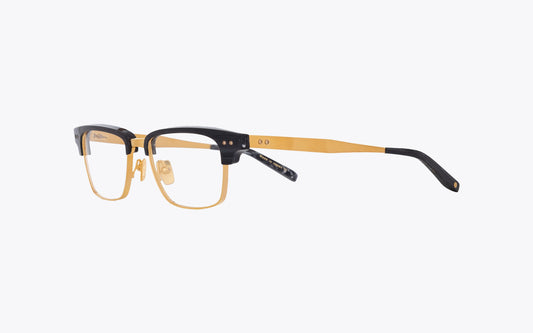 Three quarters view of Dita-Statesman-Three-DTX-2064 Eyeglasses with grey and gold frame on a white background