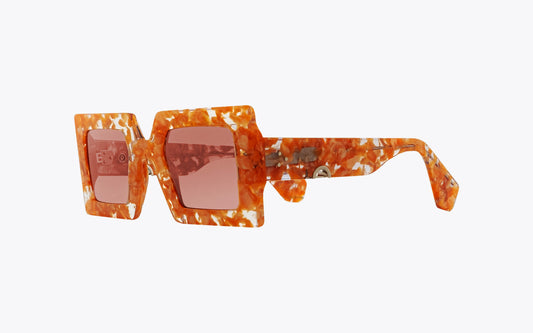Robert La Roche Godfather Sunglasses with pearl peach marbled on a white background