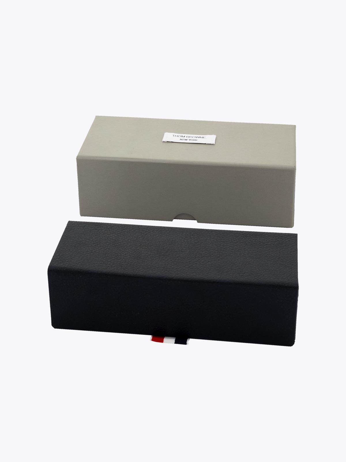 Thom Browne TBS-916 Black/Gold Sunglasses Packaging Front View