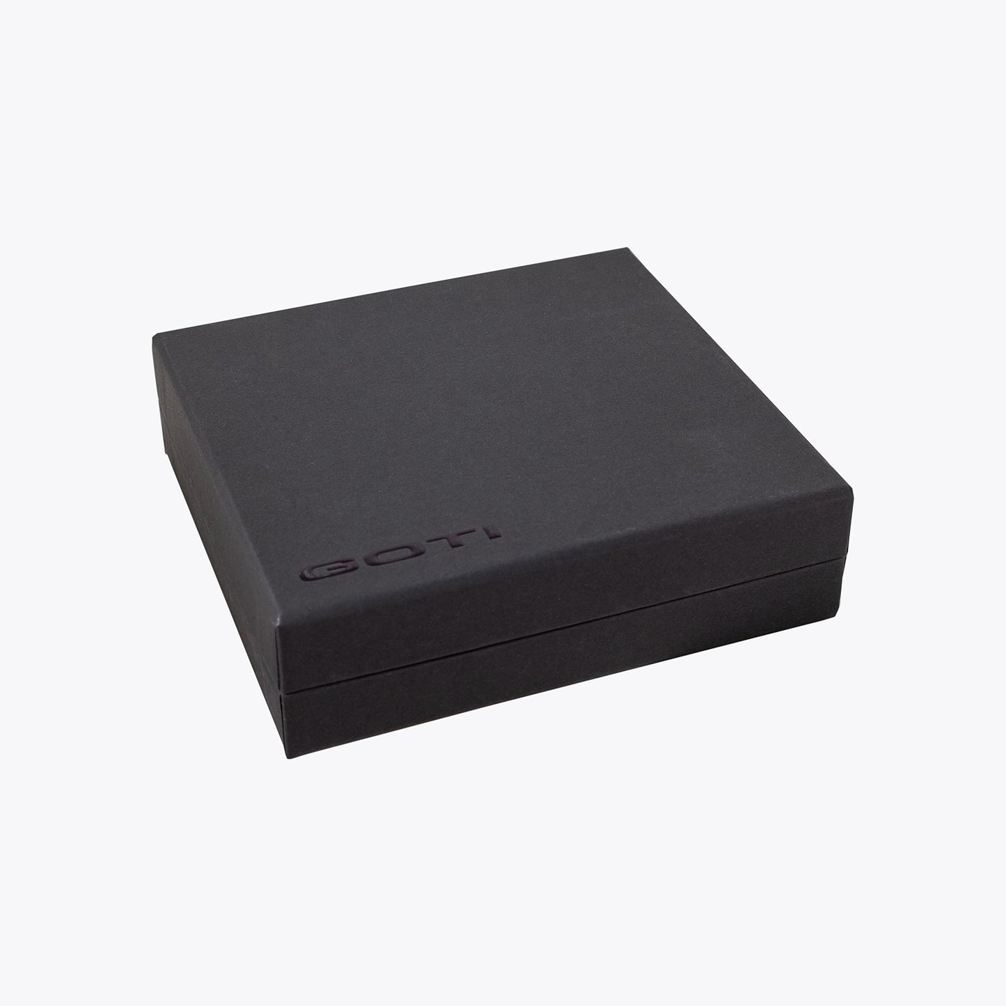 Black jewelry box with 'GOTI' branding on a white background