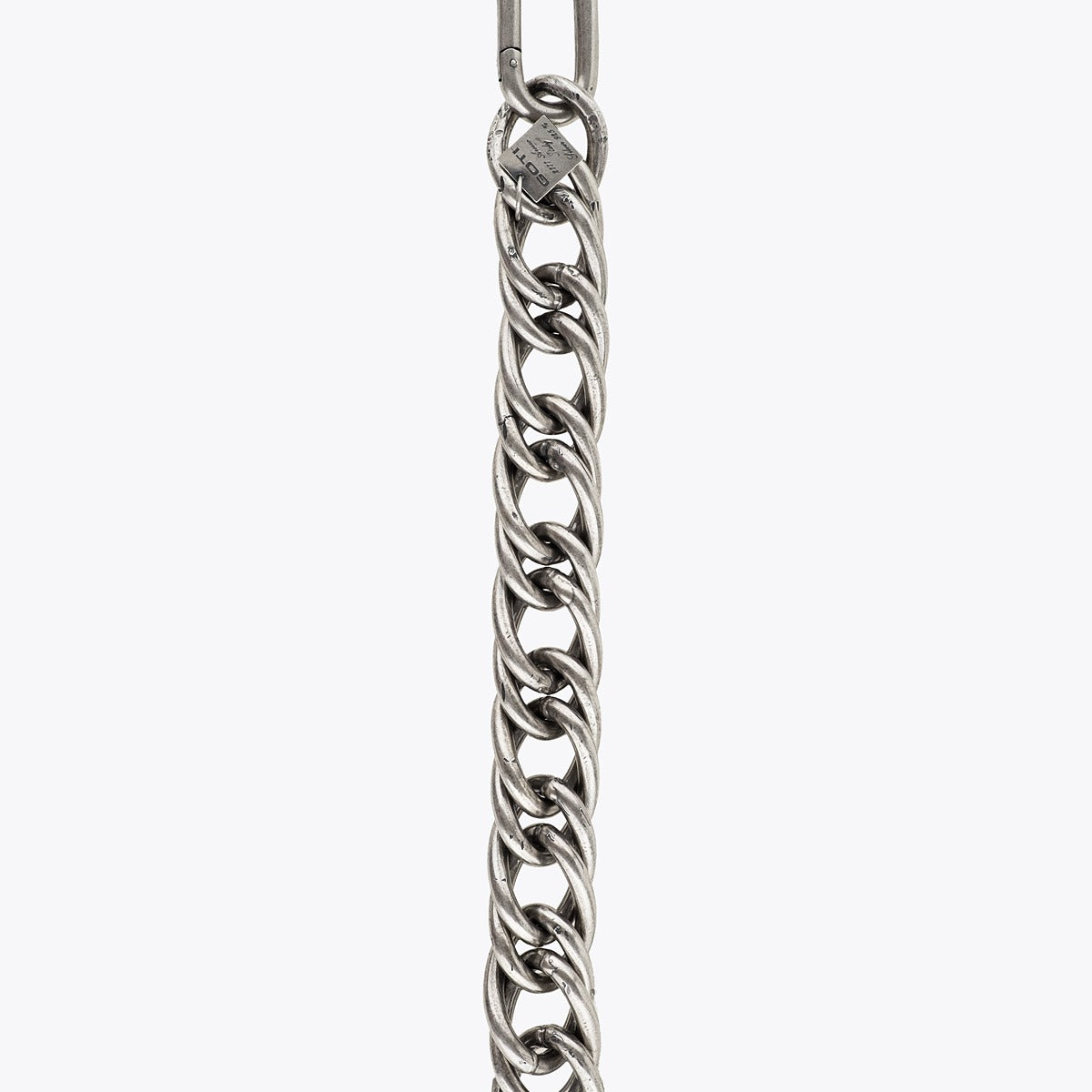 Silver link chain necklace on a white background