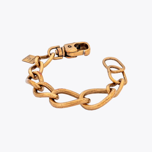 Gold plated silver curb chain bracelet on a white background