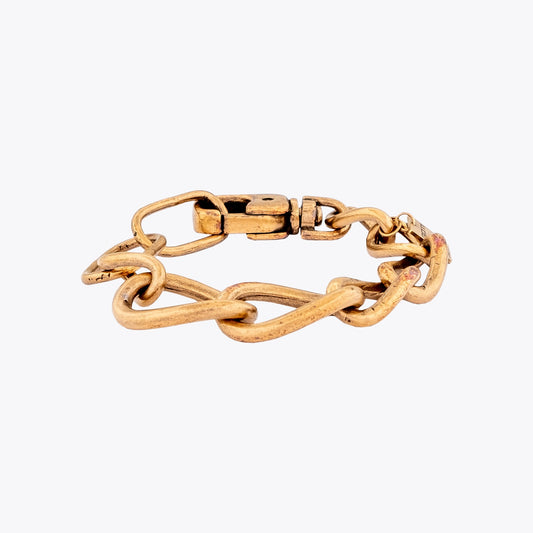 Gold plated silver curb chain bracelet on a white background
