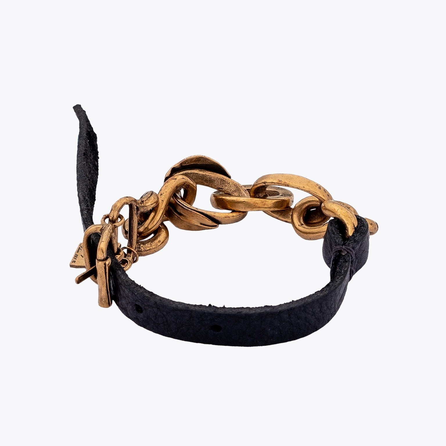 Bracelet with black leather strap and gold plated silver cable  chain on a white background