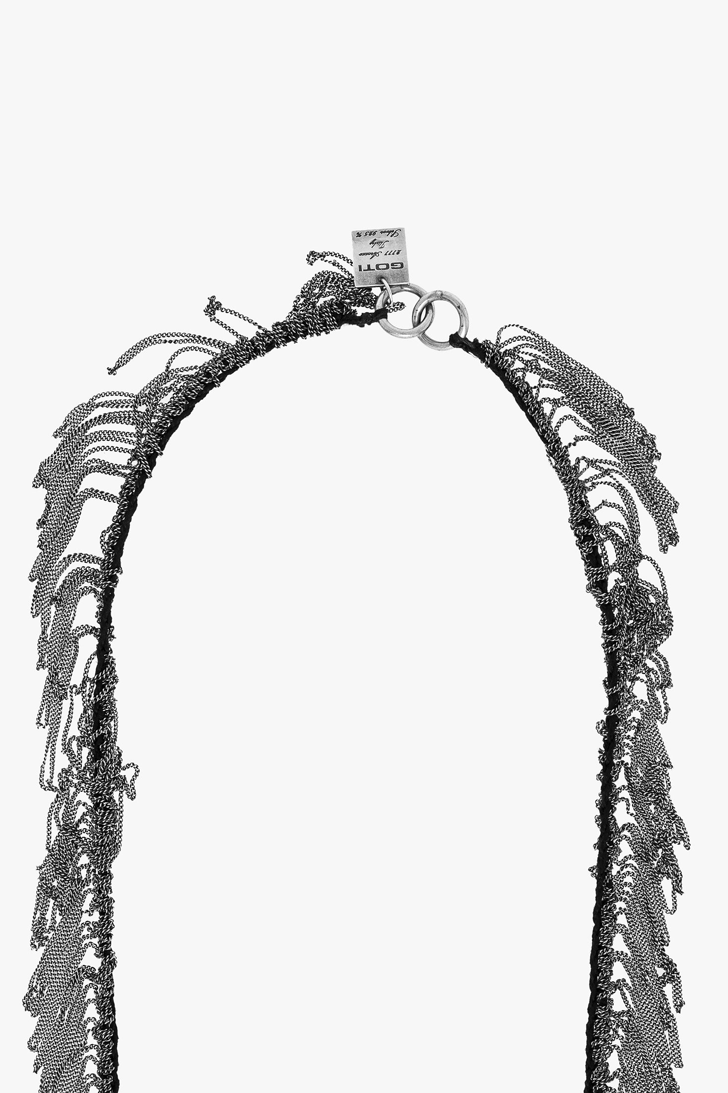 Black and white patterned necklace on a white background