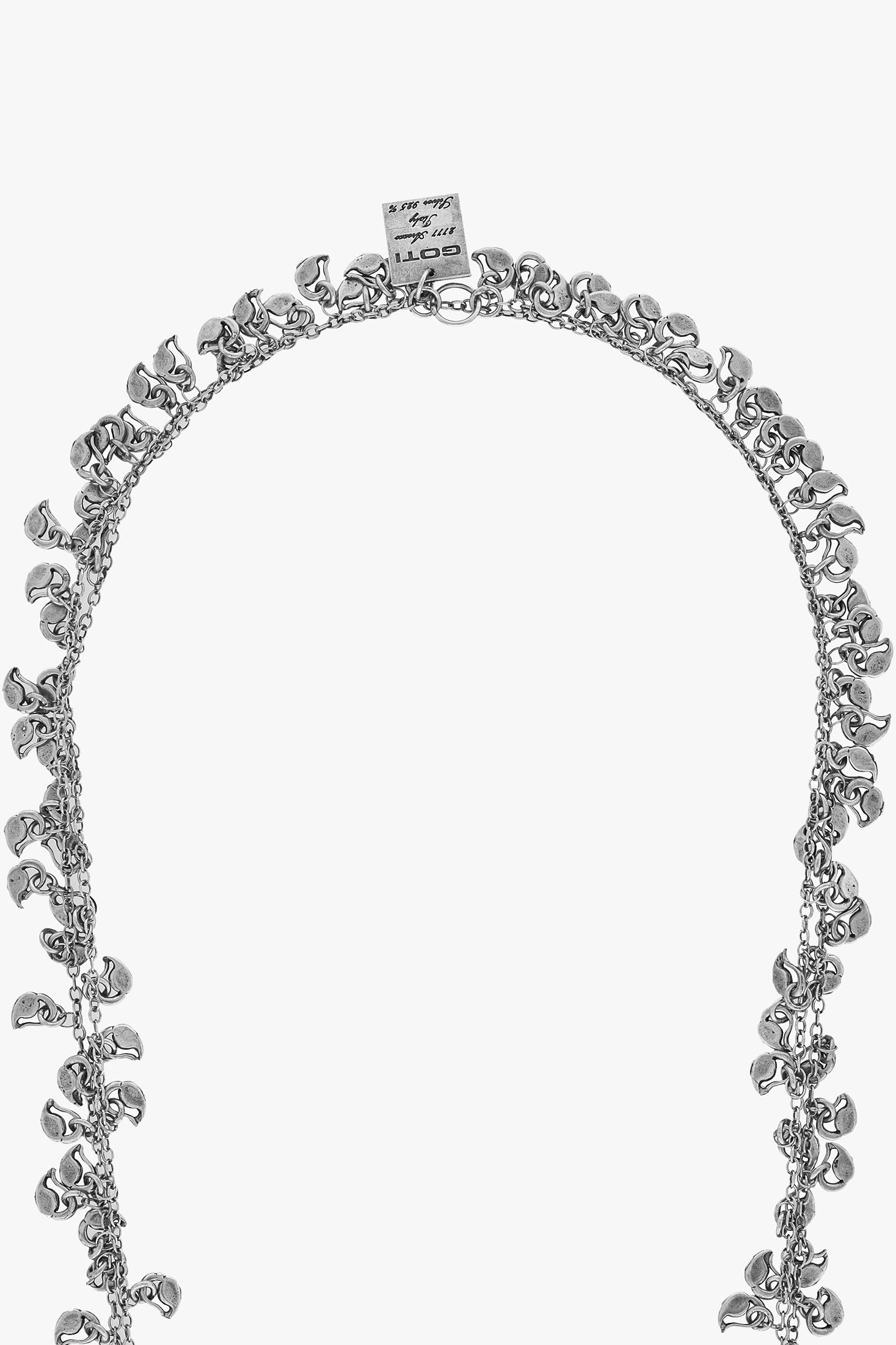 Silver necklace with floral design on a white background