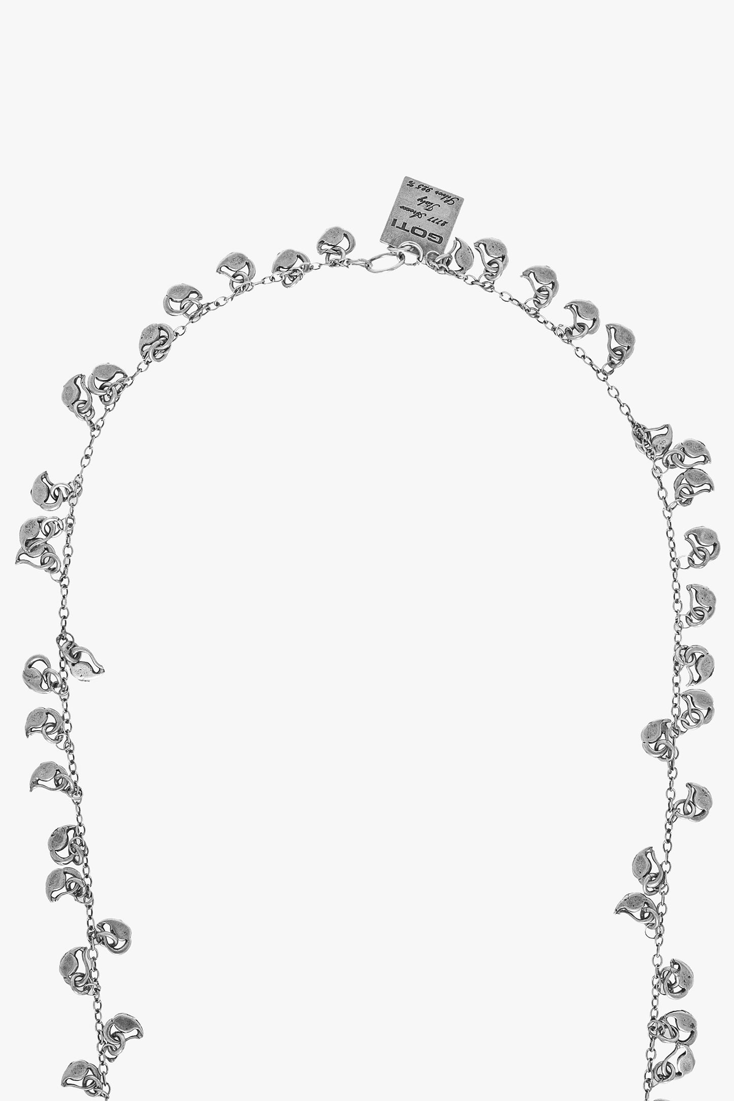 Silver necklace with floral designs on a white background